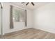 Bedroom offering window with blinds and laminate flooring at 15429 W Ventura St, Surprise, AZ 85379