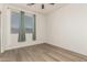 Bedroom featuring neutral walls, window and laminate flooring at 15429 W Ventura St, Surprise, AZ 85379
