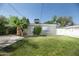 Backyard with grass, palm tree and detached garage at 1609 W Lewis Ave, Phoenix, AZ 85007