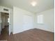 Bedroom features hardwood floors, a closet, and a window at 1609 W Lewis Ave, Phoenix, AZ 85007