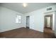 Bedroom with closet, wood floors, and neutral walls, creating a calm and inviting space at 1609 W Lewis Ave, Phoenix, AZ 85007