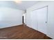 Bedroom with closet, wood floors, and neutral walls, creating a calm and inviting space at 1609 W Lewis Ave, Phoenix, AZ 85007