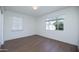 Bright bedroom with hardwood floors and natural light at 1609 W Lewis Ave, Phoenix, AZ 85007