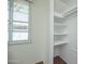 Walk-in closet with shelving, offering ample storage and organization options at 1609 W Lewis Ave, Phoenix, AZ 85007