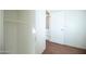 Walk in closet with hardwood floors, door to kitchen at 1609 W Lewis Ave, Phoenix, AZ 85007