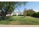 Charming home with well-manicured front yard and mature tree at 1609 W Lewis Ave, Phoenix, AZ 85007