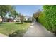 Charming front yard featuring a lush green lawn and a long driveway at 1609 W Lewis Ave, Phoenix, AZ 85007