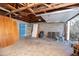 Detached garage interior with open rafters and shelving at 1609 W Lewis Ave, Phoenix, AZ 85007