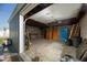 Spacious detached garage with shelving and open rafters at 1609 W Lewis Ave, Phoenix, AZ 85007