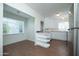 Kitchen and eating area with hardwood floors and bright light at 1609 W Lewis Ave, Phoenix, AZ 85007