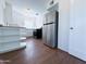 Open kitchen layout with stainless steel refrigerator at 1609 W Lewis Ave, Phoenix, AZ 85007