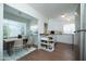 Bright eat-in kitchen with wood floors featuring an attached dining area and ample storage at 1609 W Lewis Ave, Phoenix, AZ 85007