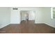 Open living room features wood floors and an archway leading to another room at 1609 W Lewis Ave, Phoenix, AZ 85007
