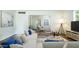 Bright living room with modern furnishings, white walls and a seamless open layout at 1609 W Lewis Ave, Phoenix, AZ 85007