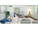 Bright living room with white sofa, wood floors, and modern decor at 1609 W Lewis Ave, Phoenix, AZ 85007