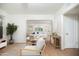 Well-lit living room with hardwood floors offering a view of a relaxed seating area at 1609 W Lewis Ave, Phoenix, AZ 85007