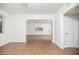 Spacious living room with wood floors, neutral walls, and open archway to the house at 1609 W Lewis Ave, Phoenix, AZ 85007