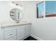 Bathroom features round mirror, quartz countertop, and marble sink at 1621 W Mulberry Dr, Phoenix, AZ 85015