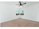 Bright bedroom with neutral carpet and view of the exterior through the window at 1621 W Mulberry Dr, Phoenix, AZ 85015