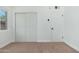 Bedroom features a closet with sliding doors and access to the exterior at 1621 W Mulberry Dr, Phoenix, AZ 85015