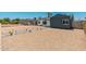 Wide view of a gravel front yard and charming home with neutral colors and tasteful landscaping at 1621 W Mulberry Dr, Phoenix, AZ 85015