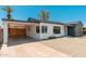 Exterior of a well-maintained home with a carport and drought-friendly gravel landscaping at 1621 W Mulberry Dr, Phoenix, AZ 85015