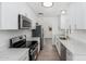 Updated kitchen with white cabinetry, stainless steel appliances, and stone countertops at 1621 W Mulberry Dr, Phoenix, AZ 85015