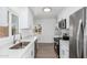 Updated kitchen with white cabinetry, stainless steel appliances, and stone countertops at 1621 W Mulberry Dr, Phoenix, AZ 85015