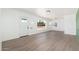 Bright, freshly-painted living room featuring hardwood floors and abundant natural light at 1621 W Mulberry Dr, Phoenix, AZ 85015