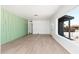 Inviting living room with hardwood flooring, freshly-painted walls, and large windows at 1621 W Mulberry Dr, Phoenix, AZ 85015