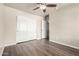Spacious bedroom with ceiling fan and closet at 17649 N Vera Cruz Ave, Maricopa, AZ 85139