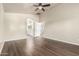 Light-filled bedroom with hardwood floors offers access to the en suite bathroom at 17649 N Vera Cruz Ave, Maricopa, AZ 85139