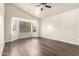 Spacious bedroom featuring a bay window that provides lots of natural light and hardwood flooring at 17649 N Vera Cruz Ave, Maricopa, AZ 85139