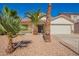 Charming single-story home with a well-manicured front yard and mature palm trees adding a tropical touch at 17649 N Vera Cruz Ave, Maricopa, AZ 85139