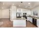 Modern kitchen with granite countertops, stainless steel appliances, and a center island, blending style with functionality at 17649 N Vera Cruz Ave, Maricopa, AZ 85139