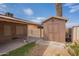 Spacious backyard featuring a storage shed and covered patio at 1814 N 89Th Ave, Phoenix, AZ 85037