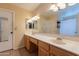 Bathroom with double vanity and tile floor at 1814 N 89Th Ave, Phoenix, AZ 85037