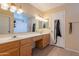 Full bathroom with a double vanity and tile floor at 1814 N 89Th Ave, Phoenix, AZ 85037