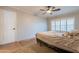 Neutral bedroom with window and plantation shutters at 1814 N 89Th Ave, Phoenix, AZ 85037