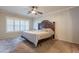 Primary bedroom with ceiling fan, window with plantation shutters, and neutral carpeting at 1814 N 89Th Ave, Phoenix, AZ 85037