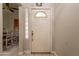 Inviting home entrance with glass block window and brass hardware at 1814 N 89Th Ave, Phoenix, AZ 85037