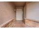Inviting home entrance with decorative light and patterned tile at 1814 N 89Th Ave, Phoenix, AZ 85037