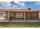 Covered patio area featuring desert landscaping and decorative security doors at 1814 N 89Th Ave, Phoenix, AZ 85037