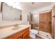 Well-lit bathroom with modern fixtures, a vanity, and a tiled shower with glass door at 1820 E Morten Ave # 119, Phoenix, AZ 85020