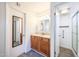 Bright bathroom boasts a vanity with storage and a separate shower area at 1820 E Morten Ave # 119, Phoenix, AZ 85020