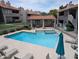 Inviting community pool and spa area with lounge chairs and shade at 1820 E Morten Ave # 119, Phoenix, AZ 85020