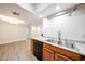 Functional kitchen space showcasing the sink and dishwasher, open to the dining area at 1820 E Morten Ave # 119, Phoenix, AZ 85020