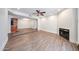 Bright living room with hardwood floors, fireplace, and recessed lighting at 1820 E Morten Ave # 119, Phoenix, AZ 85020