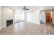 Open-concept living room features a fireplace and leads to the entryway and other living spaces at 1820 E Morten Ave # 119, Phoenix, AZ 85020