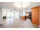 Open-concept living area with hardwood floors, a fireplace, and a modern kitchen at 1820 E Morten Ave # 119, Phoenix, AZ 85020